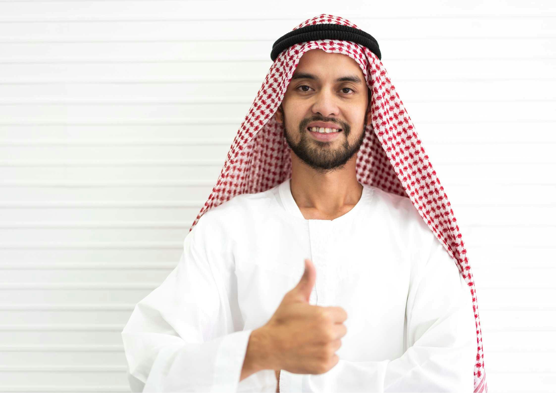 arab man showing thumbs up