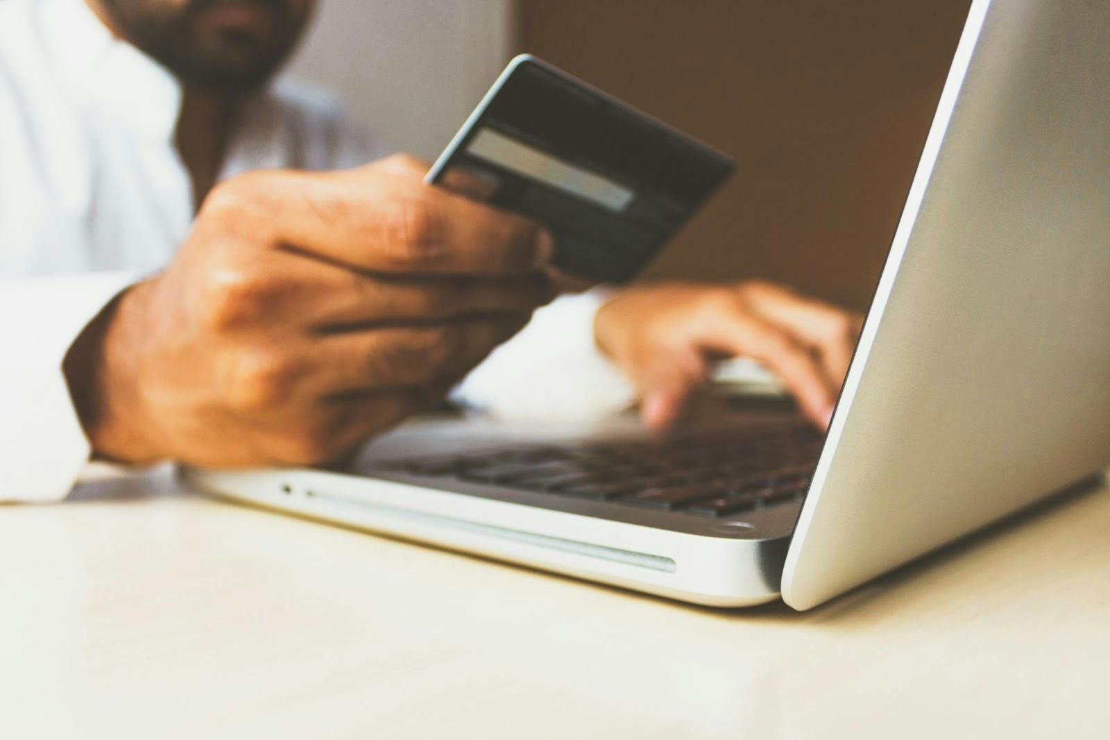 a man paying with credit card online